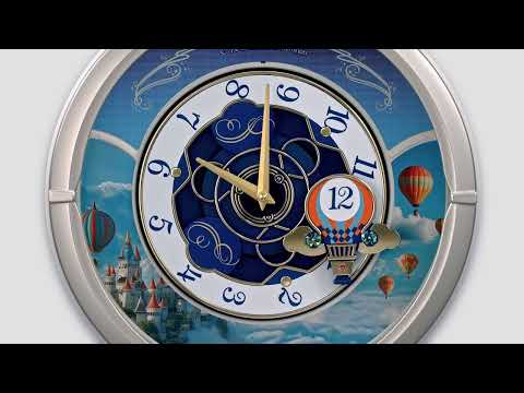 MELODIES IN MOTION ROUND MUSICAL WALL CLOCK QXM616S