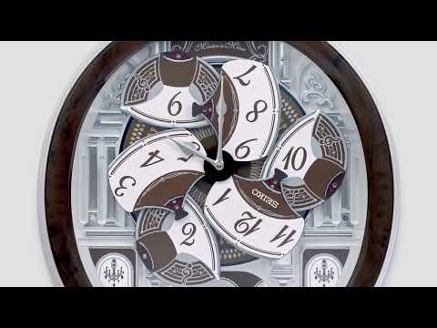 MELODIES IN MOTION ROUND MUSICAL WALL CLOCK QXM615B