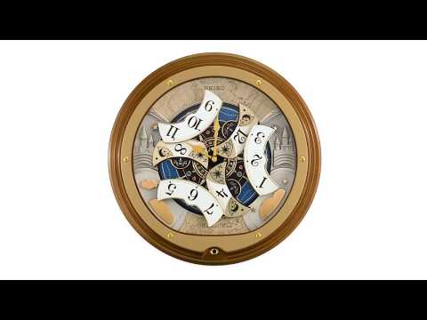 MELODIES IN MOTION ROUND MUSICAL WALL CLOCK QXM381B