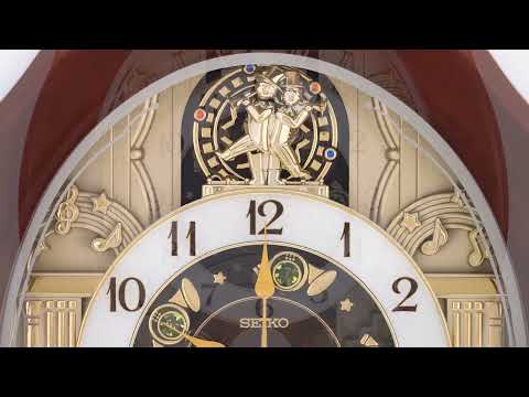 Melodies in Motion Round Musical Wall Clock QXM604B 48 cm